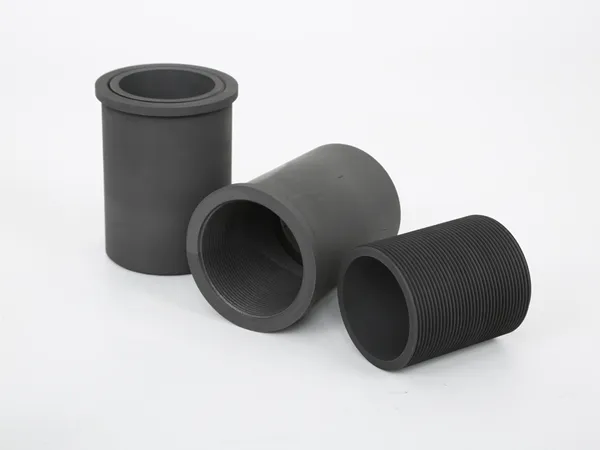 Three vacuum furnace graphite part sleeves.